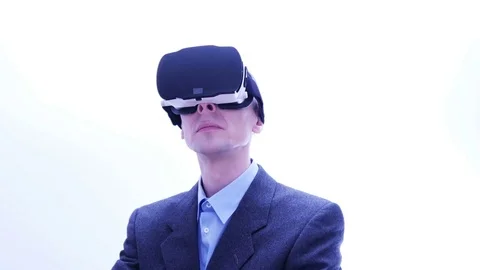 Businessman using VR-headset - 4 K Stock Footage 71203122
