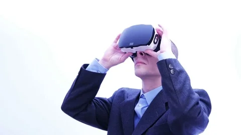 Businessman using VR-headset - 4 K Stock Footage 71208153