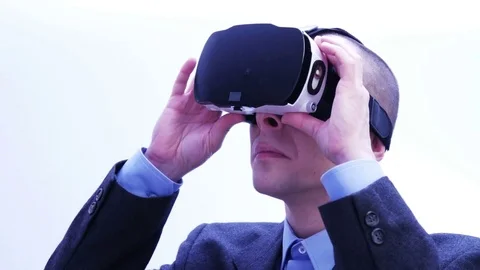 Businessman using VR-headset - 4 K Stock Footage 71210902