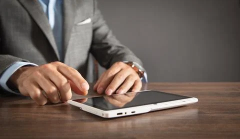 Businessman using white digital tablet. Stock Photos