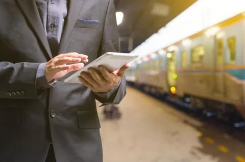 Businessman using Wireless Digital Tablet PC computer at Train, Railway or .. Stock Photos