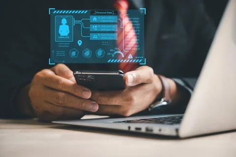 Businessman utilizing digital technology and a holographic interface to choose Stock Photos