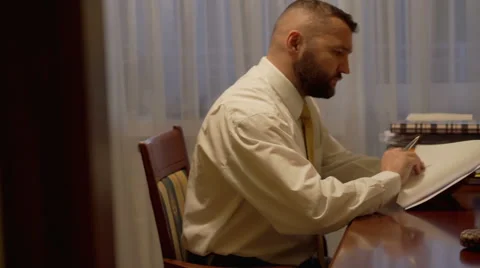 Businessman viewing some documents at home office  Stock Footage 62087521