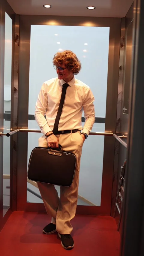 Businessman waits for colleague in elevator Stock Footage 333511652