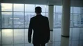 The businessman walk and phone near the panoramic window. Slow motion 4k or 4k+ Resolution