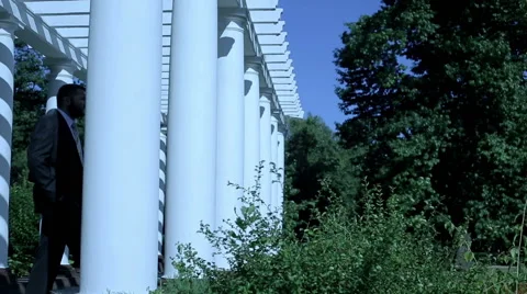 Businessman walk into column and looks away  Stock Footage 59089205