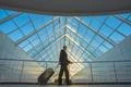 The businessman walk with a suitcase in the business center Photo