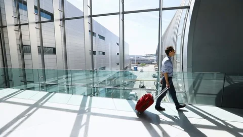 Businessman walking airport terminal boarding gate, business travel, flight Stock Footage