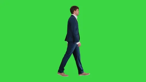Businessman walking and explaining something to camera on a Green Screen, Chroma Stock Footage 138870955
