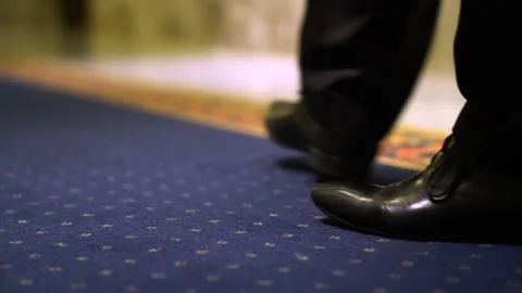 Businessman walking on carpet in hotels. Close-up Stock Footage