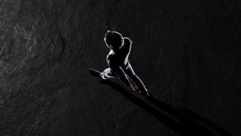 Businessman walking on dark stone surface top view Stock Footage 310793631