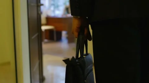 Businessman walking down the corridor office with briefcase in hand Video stock 54512005
