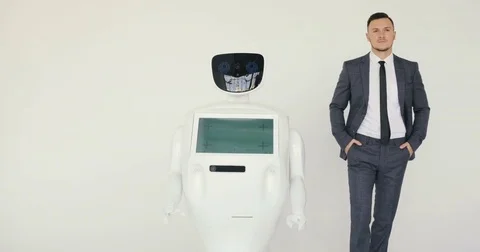 Businessman walking with robot. Cybernetic system today. Modern Robotic Stock Footage 80424335