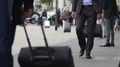 Businessman walking in the street near train station, tourism, slow-motion HD Footage