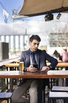 Businessman watching the time while waiting for a person Foto stock