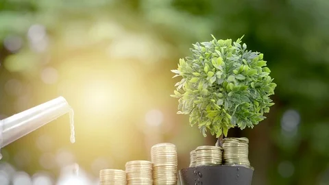 Businessman watering tree and money gold coin with can. growth, investment Stock Footage