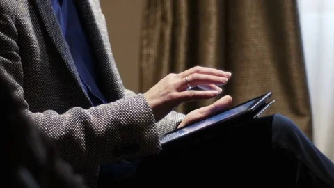 Businessman wearing suit using tablet computer 4 K Stock Footage 76086581
