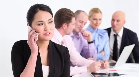 Businessman welcoming smiles on the background of his team Stock Footage 59791594
