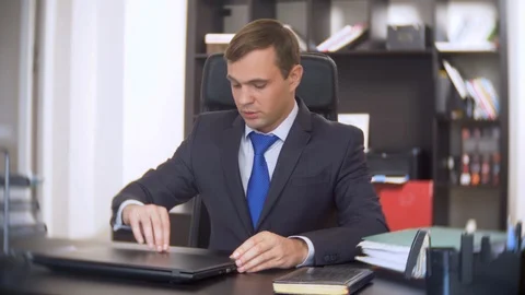 Businessman who scans documents, does not perform an urgent task in the office Stock Footage 88100768