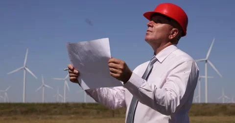 Businessman Wind Turbines Developer Examine Renewable Alternative Energy Sheets Stock Footage 54996611