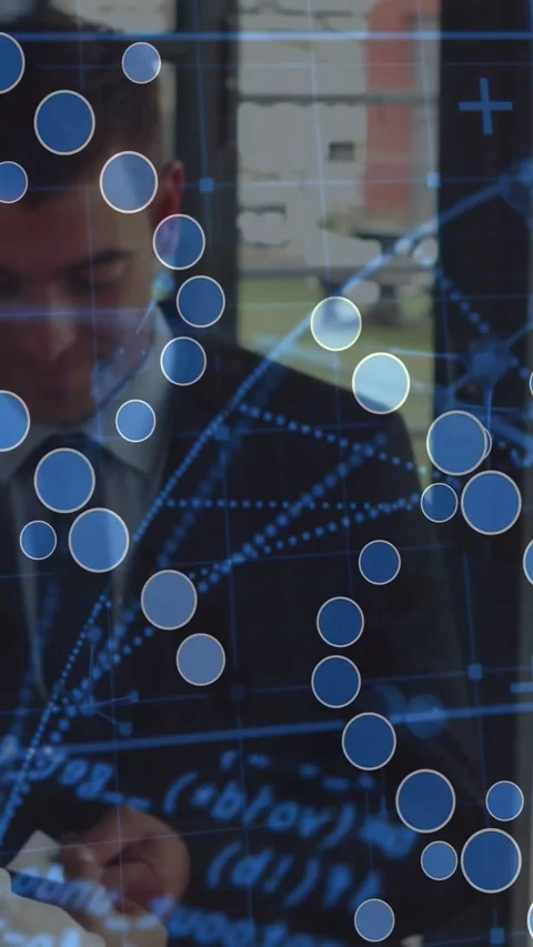 Businessman at window handling small device, checking data via shifting blue Stock Footage 330273084