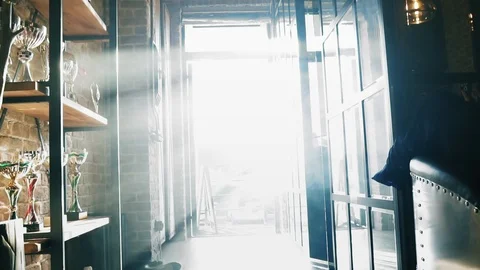 Businessman winner with jacket and briefcase in hand walks into office, where Stock Footage 101894146