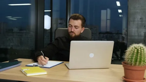 Businessman work at the computer in office Stock Footage 138625750