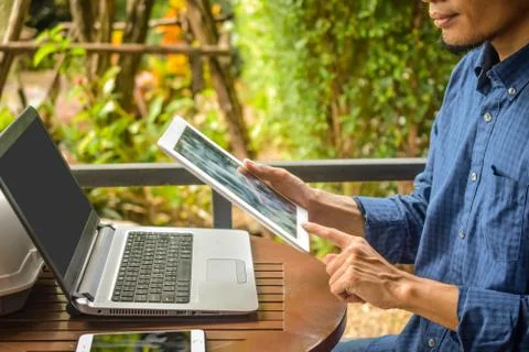 Businessman worker using tablet checking email by internet Stock Photos