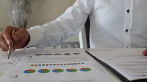 Businessman working analysis data table Stock Footage 67836425