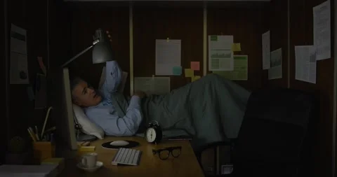 Businessman working and sleeping in his small office Stock Footage 308922828