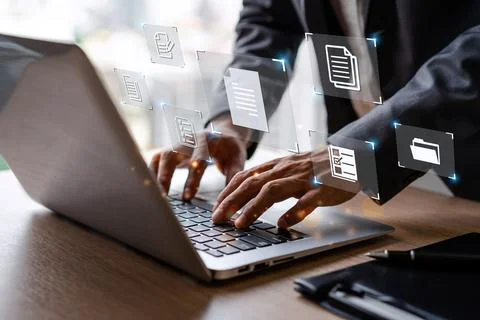 Businessman working and using a computer to manage online documentation database Fotos Stock