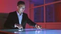 The businessman working with a big display in the dark office 4k or 4k+ Resolution