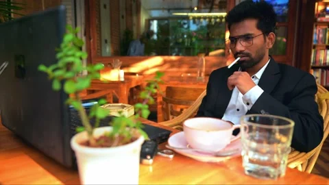 Businessman Working in Cafe with Cigarette Stock Footage 281335100