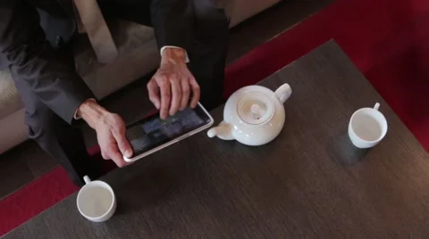 Businessman working in cafe with tablet Video stock 57456705