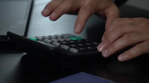 Businessman working with calculator Stock Footage 244744522