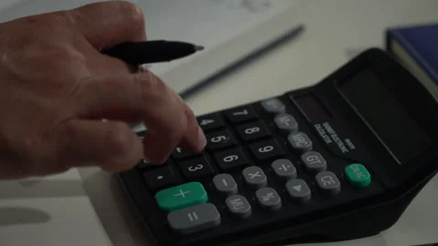 Businessman working with calculator Stock Footage 245085133