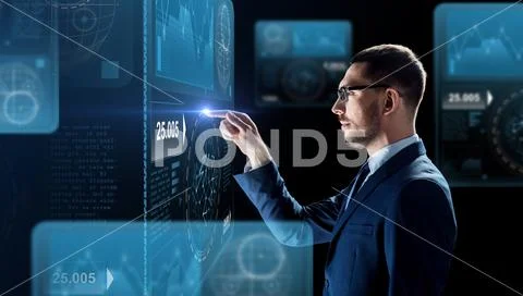 Businessman working with charts on virtual screen Stock Photos