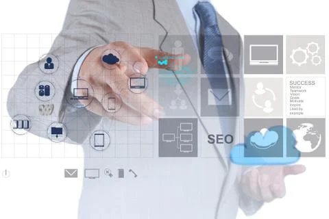 Businessman working with a cloud computing diagram on the new computer interf Illustrazione stock