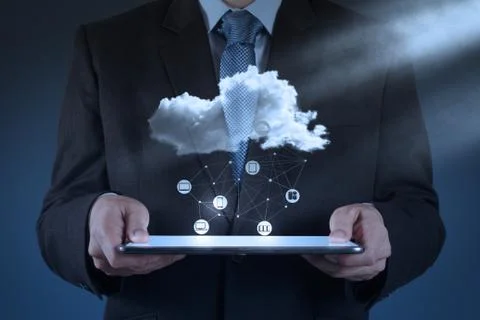 Businessman working with a cloud computing diagram on the new computer interf Illustrazione stock