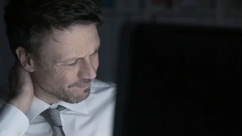 Businessman working with a computer and having neck pain Stock Footage 89201983