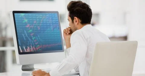 Businessman working on computer at desk Foto stock