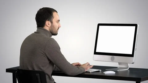 Businessman working with a computer on gradient background. Stock Footage 112645907