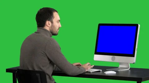 Businessman working with a computer on a Green Screen, Chroma Key. Blue Screen Stock Footage 98972653
