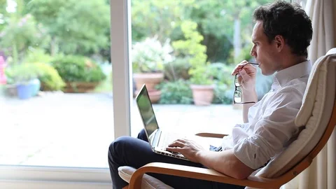 Businessman working on computer at home, telecommuting concept Stock Footage 98093659