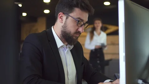 Businessman Working at the Computer in the Office with Coffee Stock Footage 107347125