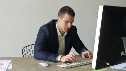 Businessman working at the computer in the office Video stock 107942823