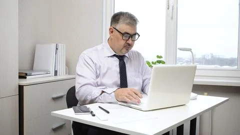 Businessman Working on Computer in Office 写真素材