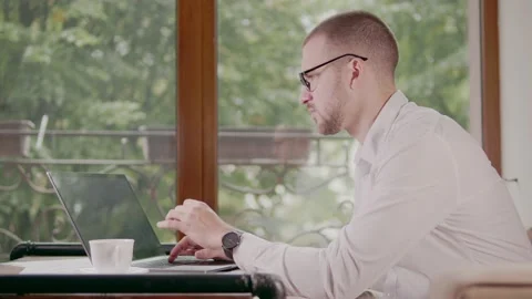 Businessman working on a computer outside the office in a cafe Stock Footage 159901024