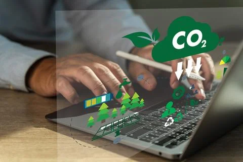 Businessman working computer to reduce CO2 depicting the issue of carbon di.. Stock Photos