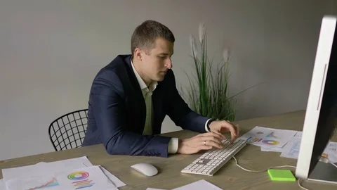 Businessman working at the computer, typing on the keyboard Stock Footage 110943527